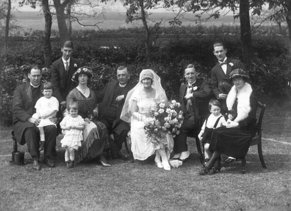 The marriage of Captain James Craig to Miss Kathleen M.C. Northey, wedding group [family]. 