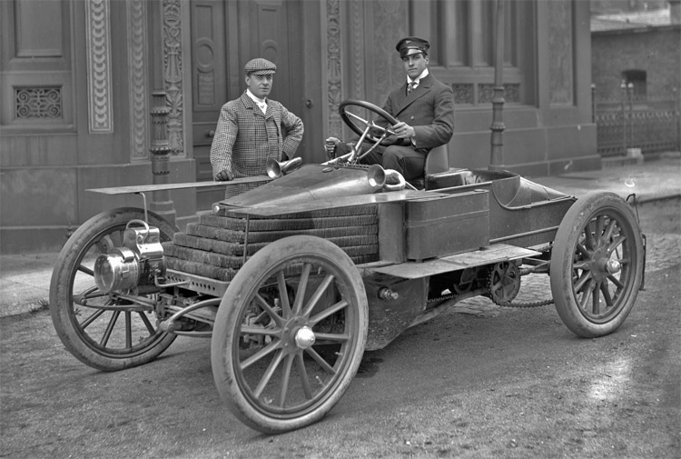 Lieutenant-Commander Montague Grahame-White (1877-1961), racing driver, car, yacht & aeroplane broker, at the wheel of a [4-cylinder, 30 h.p. or 45 h.p.] Wolseley racing car with actor Julius Knight (1863-1941).