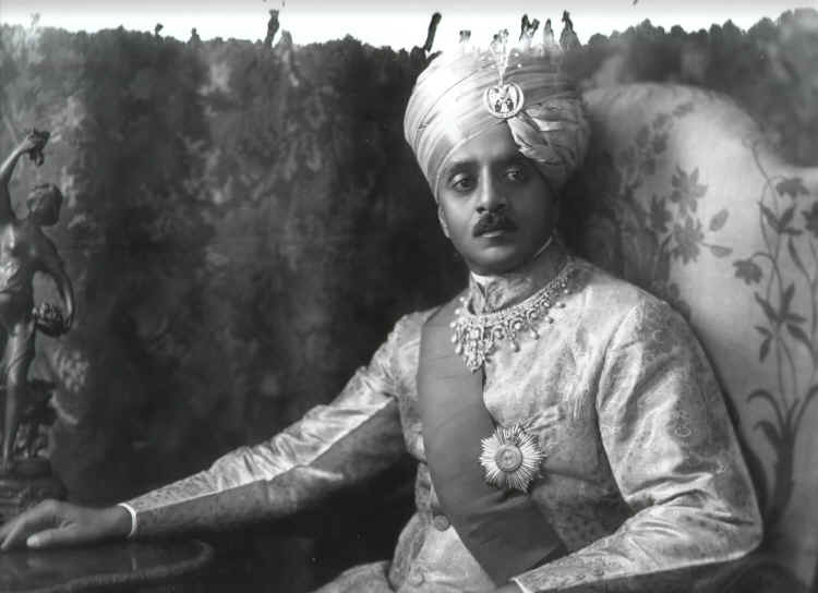 Yuvaraja Sri Sir Kanthirava Narasimharaja Wadiyar Bahadur, GCIE (1.1.1915). b. at Mysore Palace, 5th June 1888, second son of H.H. Maharaja Sri Sir Charmarajendra IX Wadiyar Bahadur, Maharaja of Mysore, GCSI, by his wife H.H. Soubhagyavati Maharani Sri Vani Vilasa Sannidhana Kempananjammani Avaru, CI. Educ. Royal Sch., Mysore and Mayo Coll., Ajmer. Extraordinary MEC, 28/1/1914 – 1920 (in charge of Military, Police, Medical, Prisons, and Sanitary Depts.). Granted the personal style of ‘Highness’, 1st January 1918. Rcvd. Delhi Durbar Medal (1911), Silver Jubilee Medal (1935) and Coron. Medal (1937). Married at Mysore, 17th June 1910, H.H. Soubhagyavati Yuvarani Sri Kempu Chelvajammani Avaru, fourth daughter of The Hon Sardar Delavoi Devaraj Urs, Councillor of State and Inspector General of Police. He d. at Bombay, 11th March 1940, having had issue one son and three daughters. 